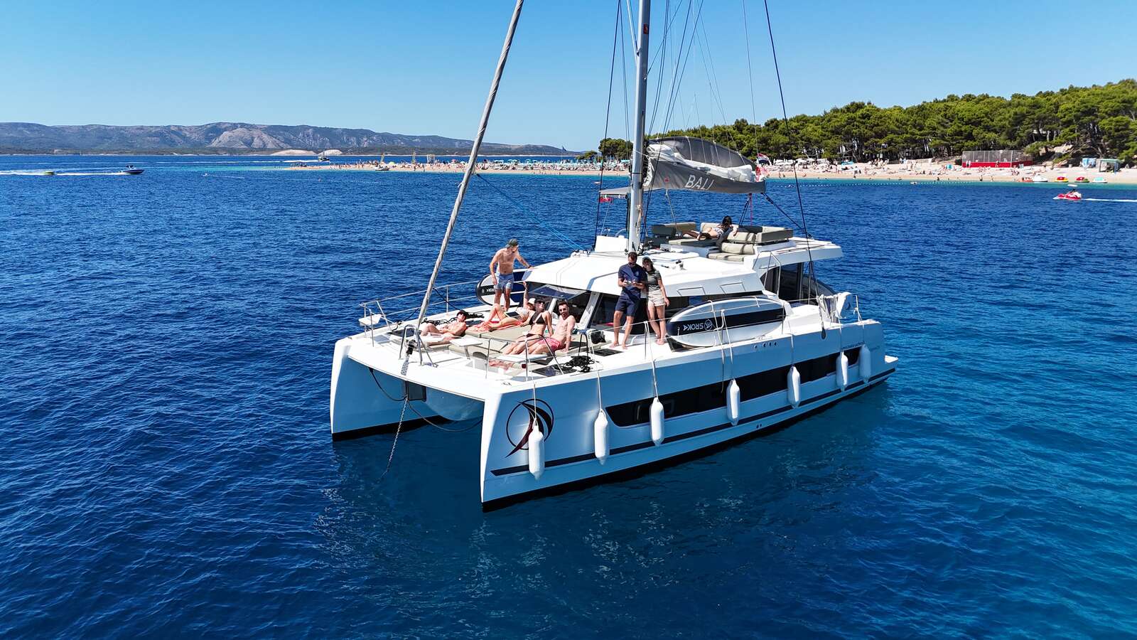 Millenavi catamaran at anchor in clear Adriatic water, yacht charter Croatia